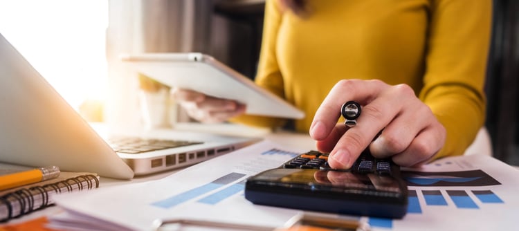 Business  women using calculator with computer laptop, Business accounting, budget and loan paper in office-