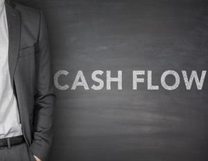 a blackboard showing the words "cash flow