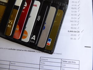 a wallet of credit cards and a bank statement